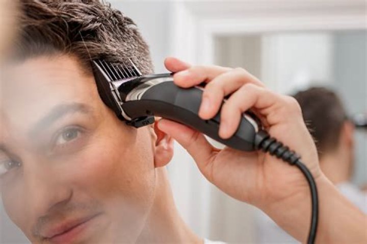 How do Barbers clean their clippers?